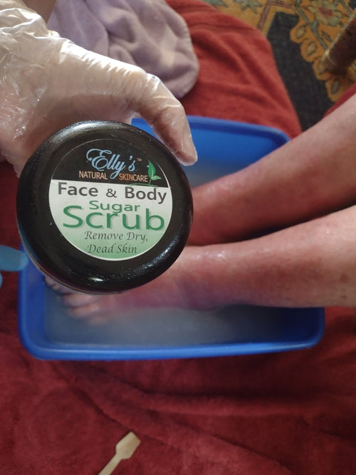 preparing to use a sugar scrub to remove severe dry skin on feet